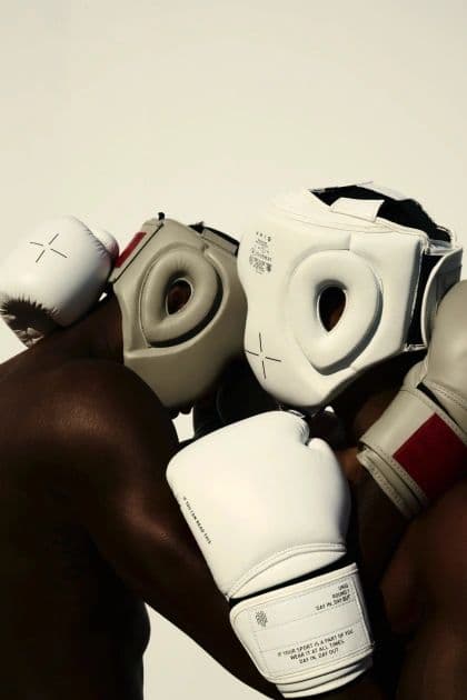 A boxer wrapping their hands before a session